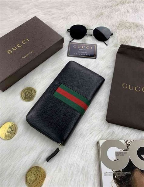 Мужские кошельки и портмоне Gucci .